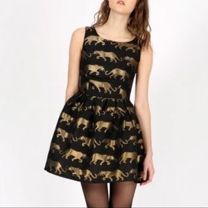 Anthropologie black and gold jaguar dress